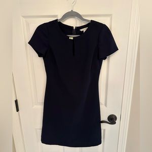 Banana republic. Navy blue short sleeved dress with gold clip at neckline